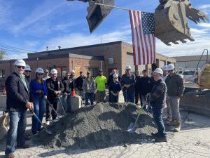 Group smiling at the groundbreaking